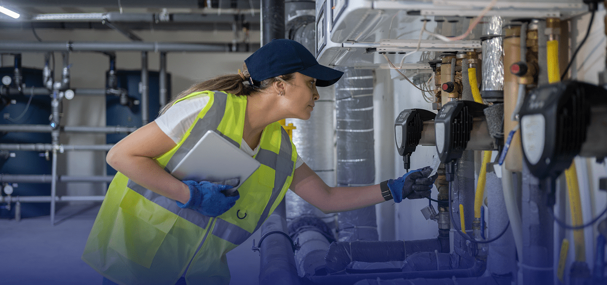 Technician inspecting industrial equipment